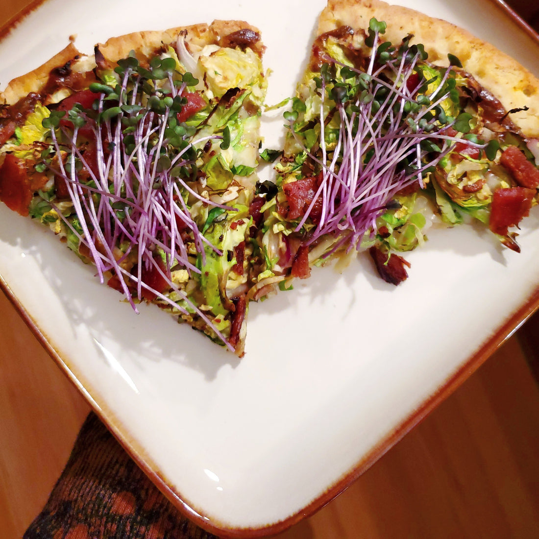 Shredded brussels sprout pizza with garlic, bacon and balsamic